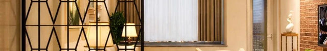 KRYNEX Stainless Steel Geometric Room Divider With Architectural Screen Pattern For Living Room Dining Area And Formal Seating Spaces