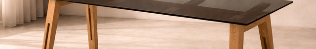Clarion Dining Table with Black Glass Tabletop and Solid Wood Legs Inspired by Modern European Design for Elegant Dining Spaces